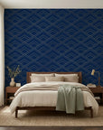 Midnight Crossing bold navy and gold geometric wallpaper in a warm and inviting living room