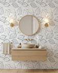 Black and white Midnight Fossil leaf pattern peel and stick wallpaper in modern bathroom with natural linen texture