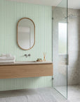 Mint and white Morse code stripe peel and stick wallpaper in modern minimalist bathroom