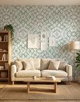 Mist & Meadow sage green abstract wallpaper in a warm and inviting living room