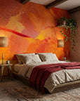 Molten Hour warm orange painterly abstract wallpaper in a warm and inviting living room