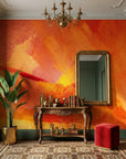 Molten Hour warm orange painterly abstract wallpaper as a feature wall in a bright home office