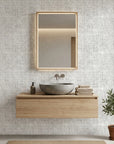 Morning Frost grey abstract weave wallpaper creating ambiance in a serene bathroom