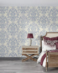 Blue and cream damask Moss Rose Mosaic wallpaper in elegant bedroom with vintage furniture