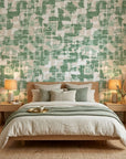 Mossy Ground green abstract peel and stick wallpaper adding character to a cozy bedroom