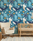 Ocean Dreams teal blue whale and octopus wallpaper in a warm and inviting living room