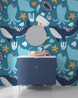 Aquatic peel and stick mural showcasing intricate teal octopuses and blue whales amongst stylized waves. - Ocean Dreams