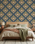 Old World Flora teal and gold damask wallpaper adding character to a cozy bedroom