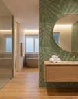 Olive Stipple textured stripe wallpaper creating ambiance in a serene bathroom