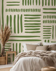 Abstract wallpaper showcasing painterly, olive green brush stroke rectangles. The arrangement forms an irregular grid resting on a gentle, warm cream surface.