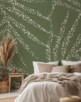 Abstract olive green wall covering textured with scattered, speckled white brushwork