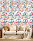 Painted Blooms pastel floral peel and stick wallpaper in a warm and inviting living room