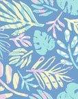 Powder blue wallpaper decorated with large, chalky tropical palms colored in delicate pastels