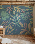 An airy, blue wall treatment featuring hand-drawn tropical palm fronds in light, muted tones