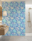 Painted Breeze pastel palm wallpaper creating ambiance in a serene bathroom