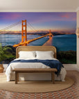 Golden Gate Bridge at sunset mural wallpaper with orange bridge spanning blue bay waters in bedroom setting