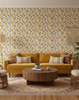 Painted Tulip Field vibrant watercolor tulip wallpaper in a warm and inviting living room