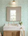 Pale Dawn serene green plaid wallpaper creating ambiance in a serene bathroom