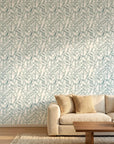 Pale Grove serene blue botanical wallpaper in a warm and inviting living room
