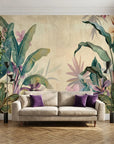 Tropical Parchment & Bloom wallpaper with pink florals and teal banana leaves on living room accent wall