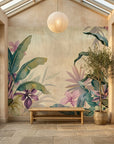 Parchment & Bloom tropical wallpaper with pink flowers and green banana leaves in sun-lit conservatory