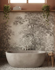 Park Promenade toile wallpaper with sepia forest scene behind freestanding tub in terracotta bathroom