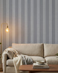 Parlor Stripe blue geometric peel and stick wallpaper in a warm and inviting living room