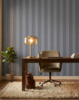 Parlor Stripe blue geometric peel and stick wallpaper as a feature wall in a bright home office