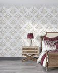 Taupe botanical leaf motifs in Pastel Bouquet Parade peel and stick wallpaper on bedroom accent wall
