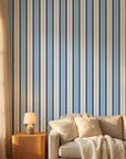 Pavilion Stripe blue and grey striped wallpaper in a warm and inviting living room