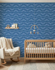 Periwinkle Drift blue dotted wave wallpaper adding character to a cozy bedroom