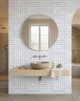 Periwinkle Shores blue geometric peel and stick wallpaper creating ambiance in a serene bathroom