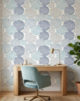 Petal Cascade blue swirls peel and stick wallpaper as a feature wall in a bright home office