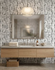 Pewter Array modern abstract grey peel and stick wallpaper creating ambiance in a serene bathroom