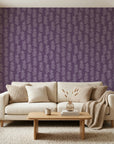 Plum & Vine serene purple trailing leaf wallpaper in a warm and inviting living room