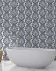 Slate blue and cream Poet's Blossom damask wallpaper in elegant bathroom with freestanding tub