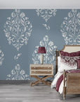 Slate blue and silver Porcelain Bouquet damask wallpaper in elegant bedroom with rustic wood furniture