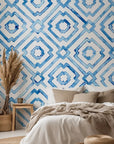 White background with a geometric diamond lattice pattern in blue, applied using a watercolor technique reminiscent of antique porcelain.