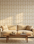Quiet Grace gold and cream minimalist arc wallpaper creating ambiance in a serene bathroom