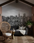 Quiet Hours city skyline wallpaper mural on living room accent wall with monochrome urban nightscape