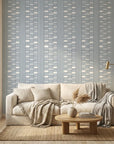 Quiet Room blue geometric peel and stick wallpaper in a warm and inviting living room