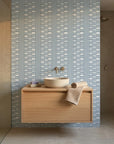 Quiet Room blue geometric peel and stick wallpaper creating ambiance in a serene bathroom