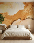 Raw Earth warm ochre textured abstract wallpaper in a warm and inviting living room