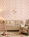 Rose Honeycomb blush geometric peel and stick wallpaper adding character to a cozy bedroom