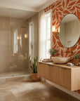 Rust Echoes bold leaf wallpaper creating ambiance in a serene bathroom