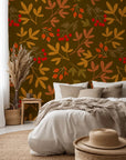 A botanical wall covering with orange leaves and scarlet berries, set against a deep brown background (Rustic Joy style)
