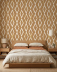 Saffron Ikat ochre geometric peel and stick wallpaper adding character to a cozy bedroom