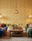 Saffron Hush warm gold chrysanthemum wallpaper in a warm and inviting living room