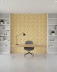 Saffron Hush warm gold chrysanthemum wallpaper as a feature wall in a bright home office