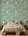 Sage Blossom serene green floral wallpaper in a warm and inviting living room
